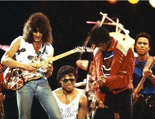 Eddie Van Halen (left) with Michael Jackson (via guitars101.com)